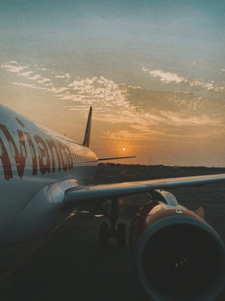 pexels-photo-20648885-20648885 A serene sunset view of an airplane on the tarmac, perfect for travel themes.